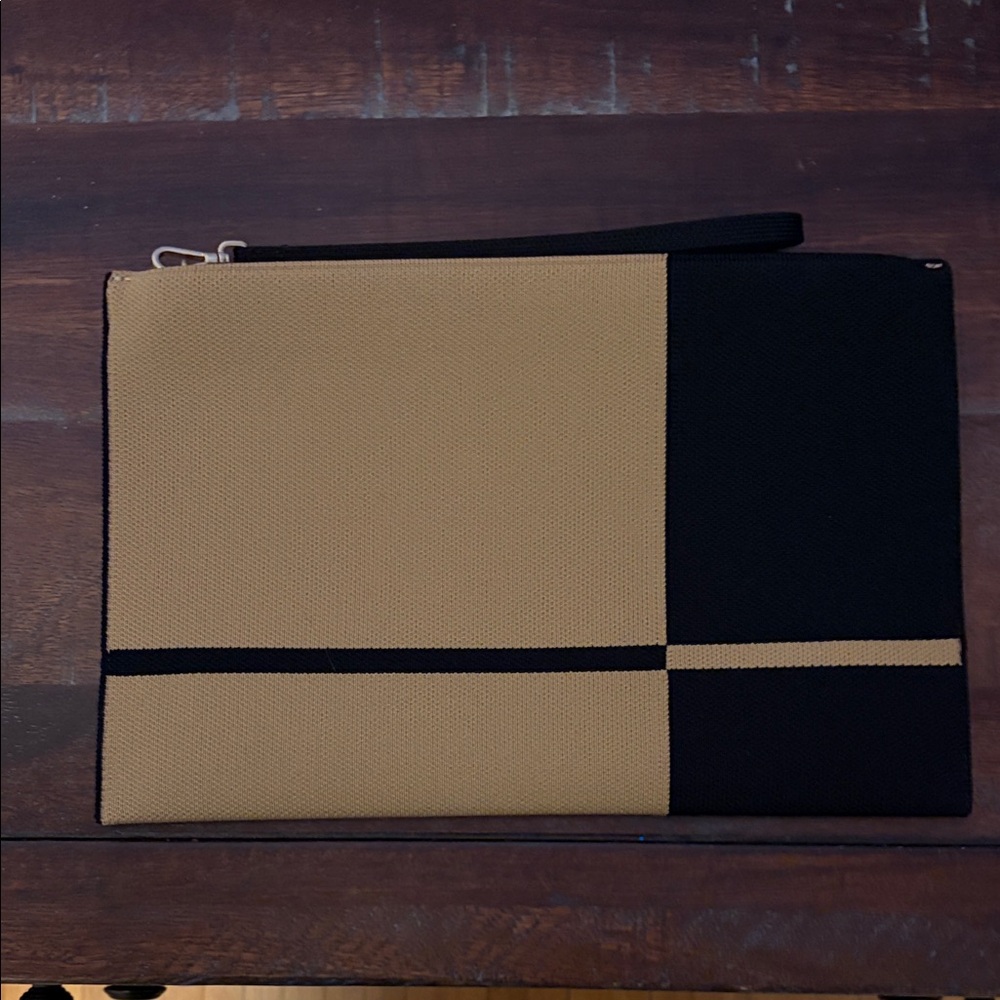 Rothy’s Black and Tan Clutch